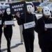 Thumbnail image for Masked protesters call for George Bush’s arrest for war crimes as he opens his presidential library.